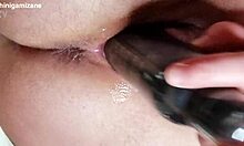 Intense close-up of dildo penetration and self-pleasure at home