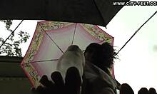 Barefoot brunette seduces in rain